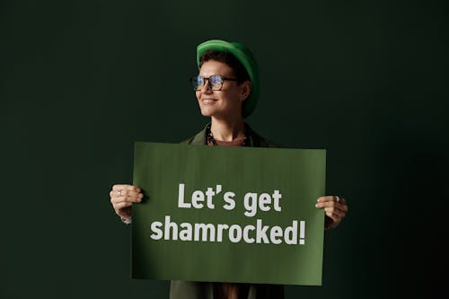 Person holding Green Placard