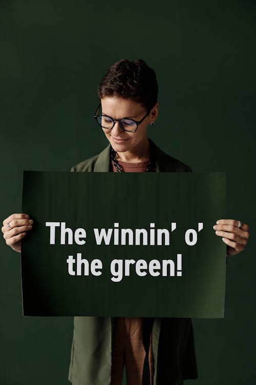 A Woman Holding a Poster with Written Message