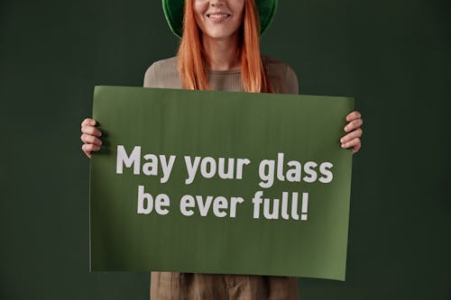 Person holding Green Placard