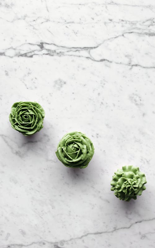 Green Cupcakes on a Marble Surface 