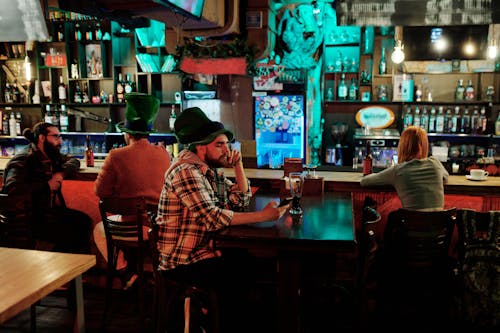 People Inside a Bar Drinking on St Patrick's Day