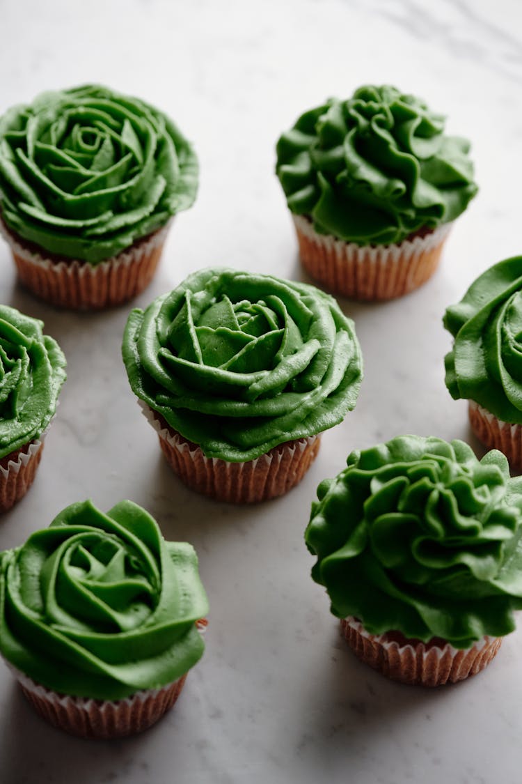 Close-Up Shot Of Cupcakes With Green Frosting