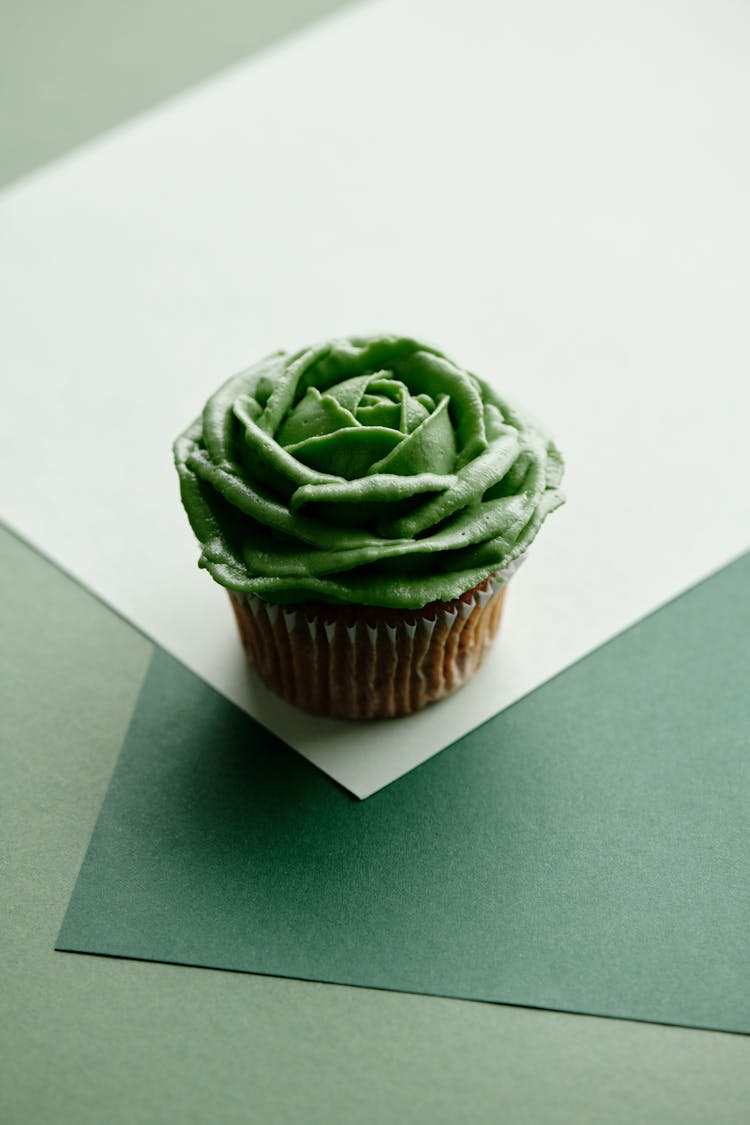 Close-Up Shot Of A Cupcake With Green Frosting