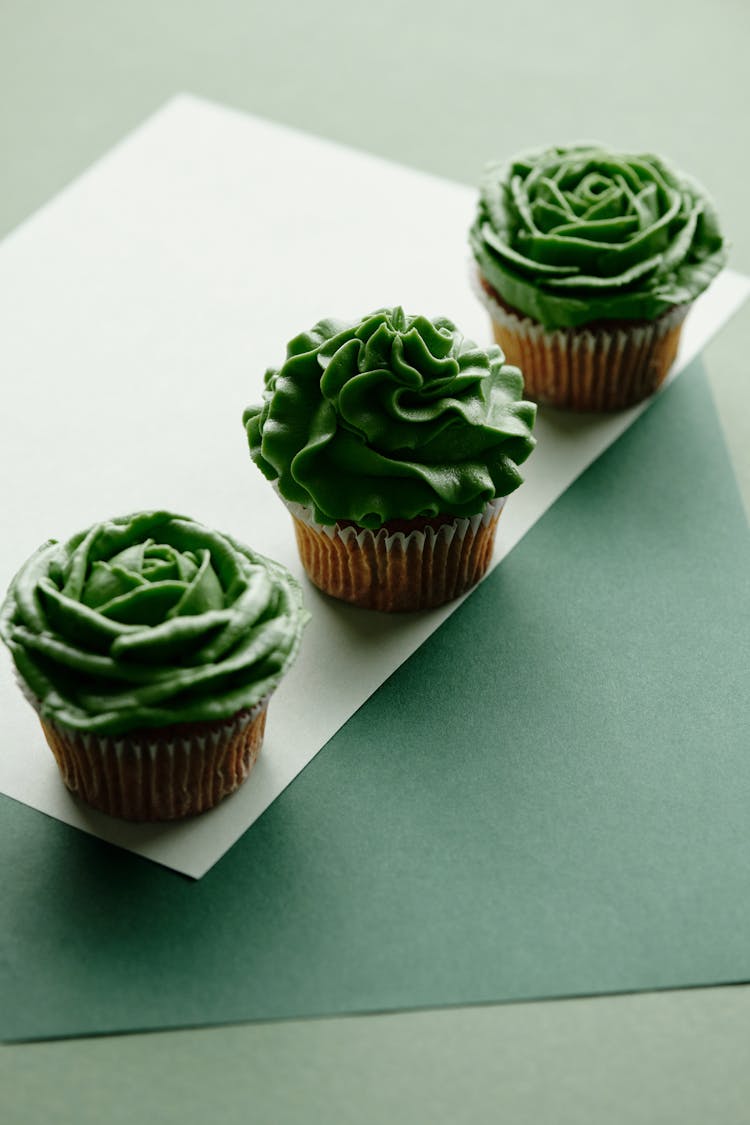 Close-Up Shot Of Cupcakes With Green Frosting