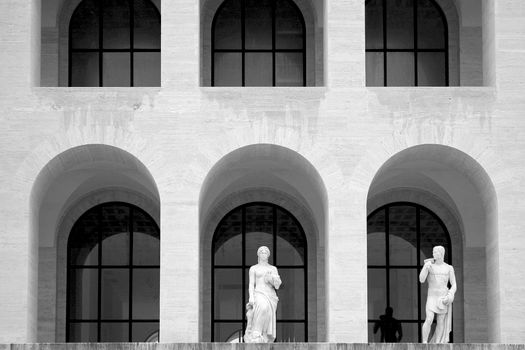 Statues under Arched Window 