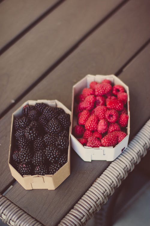 Free Raspberries And Blueberries On Top Of Table Stock Photo