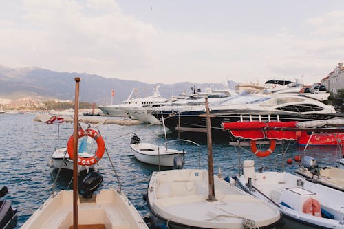 Pier with big yachts and motor boats