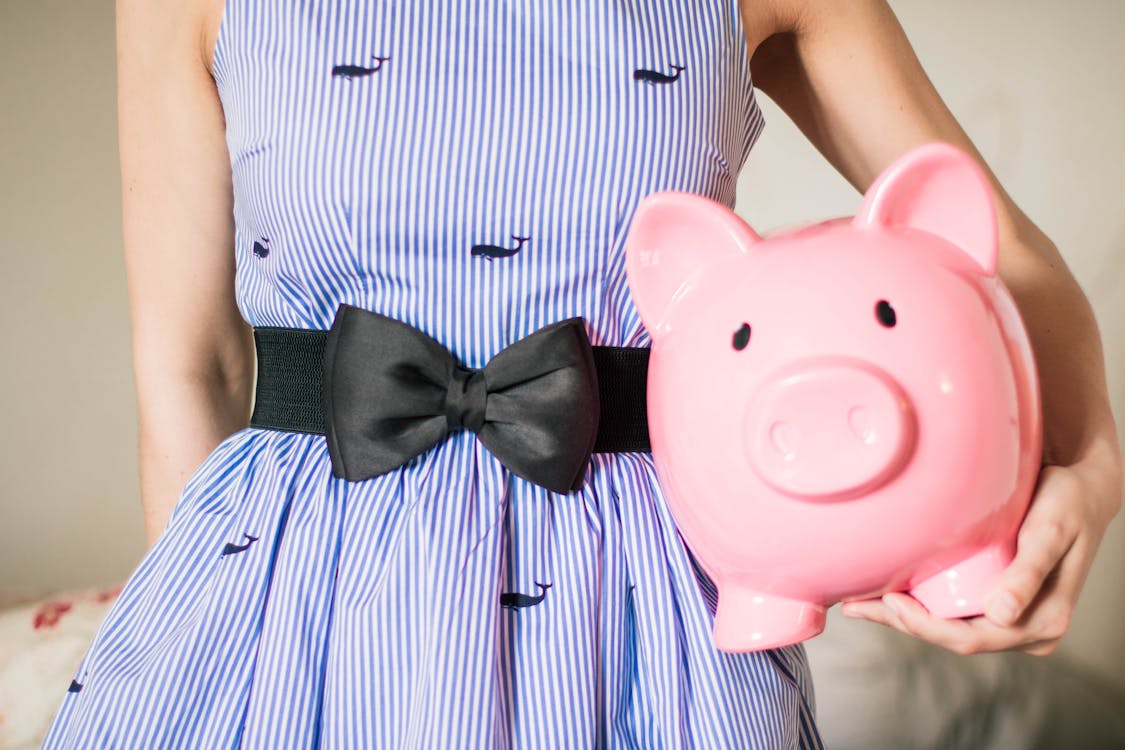 Free Person Holding a Piggy Bank Stock Photo