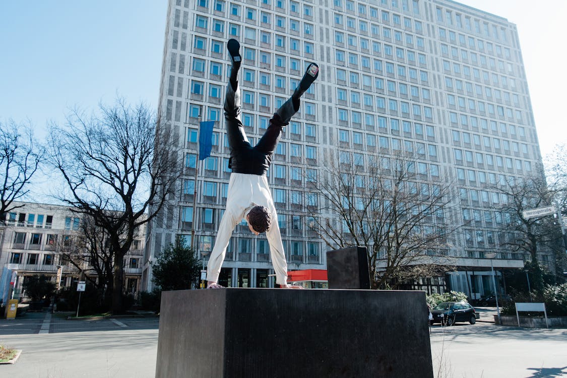Energetic Employee doing a Hand Stand 