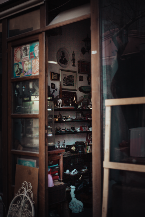 Free Explore a quaint antique shop filled with vintage collectibles and retro décor. Stock Photo
