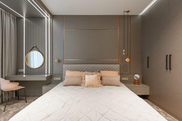 Luxury bedroom with layered textiles and ambient lighting