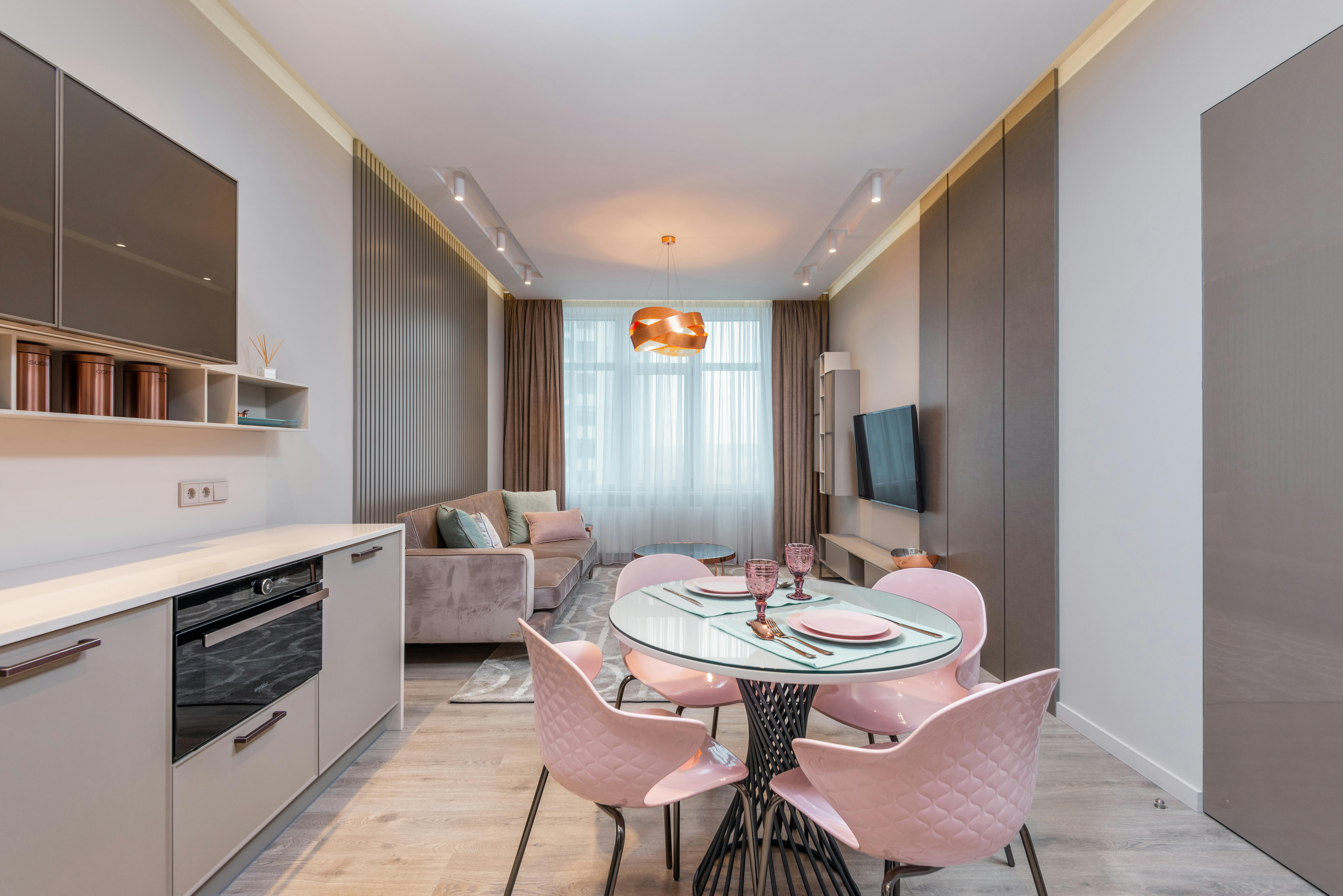 interior of modern kitchen and dining zone in apartment