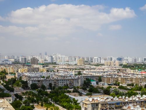 Free A vibrant aerial view of Ashgabat showcasing modern architecture and residential areas. Stock Photo