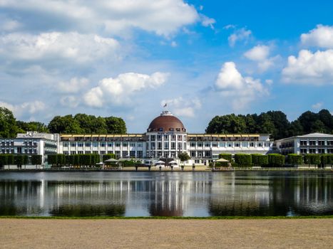 Stunning view of the luxurious Dorint Park Hotel in Bremen with its grand architectural design and scenic reflection.