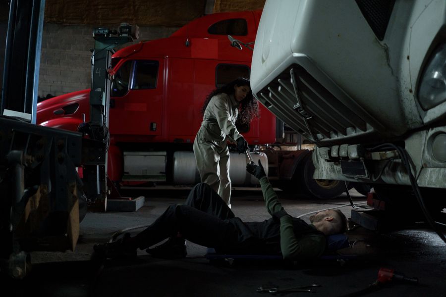 Mechanics repairing a heavy truck