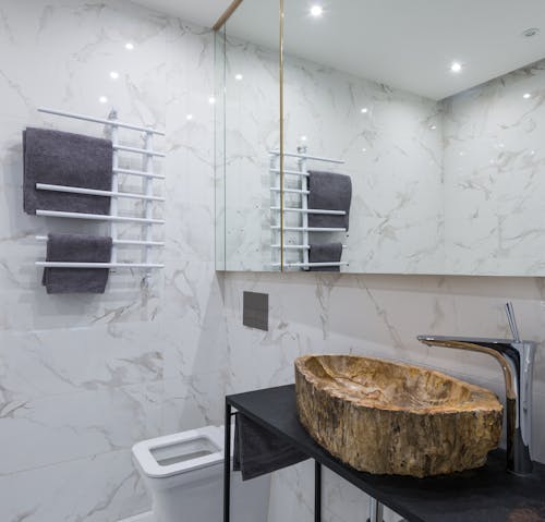 Stylish bathroom interior with toilet bowl and sink