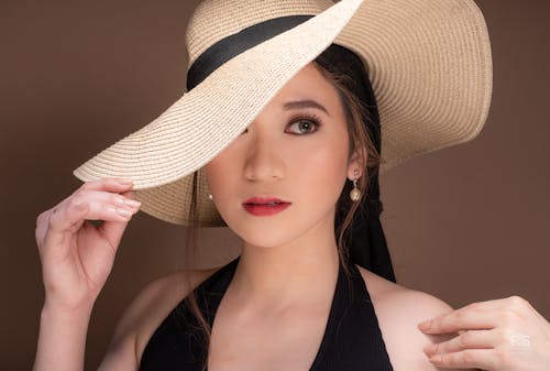 Close-Up Shot of a Beautiful Woman in Furtalk Summer Hat