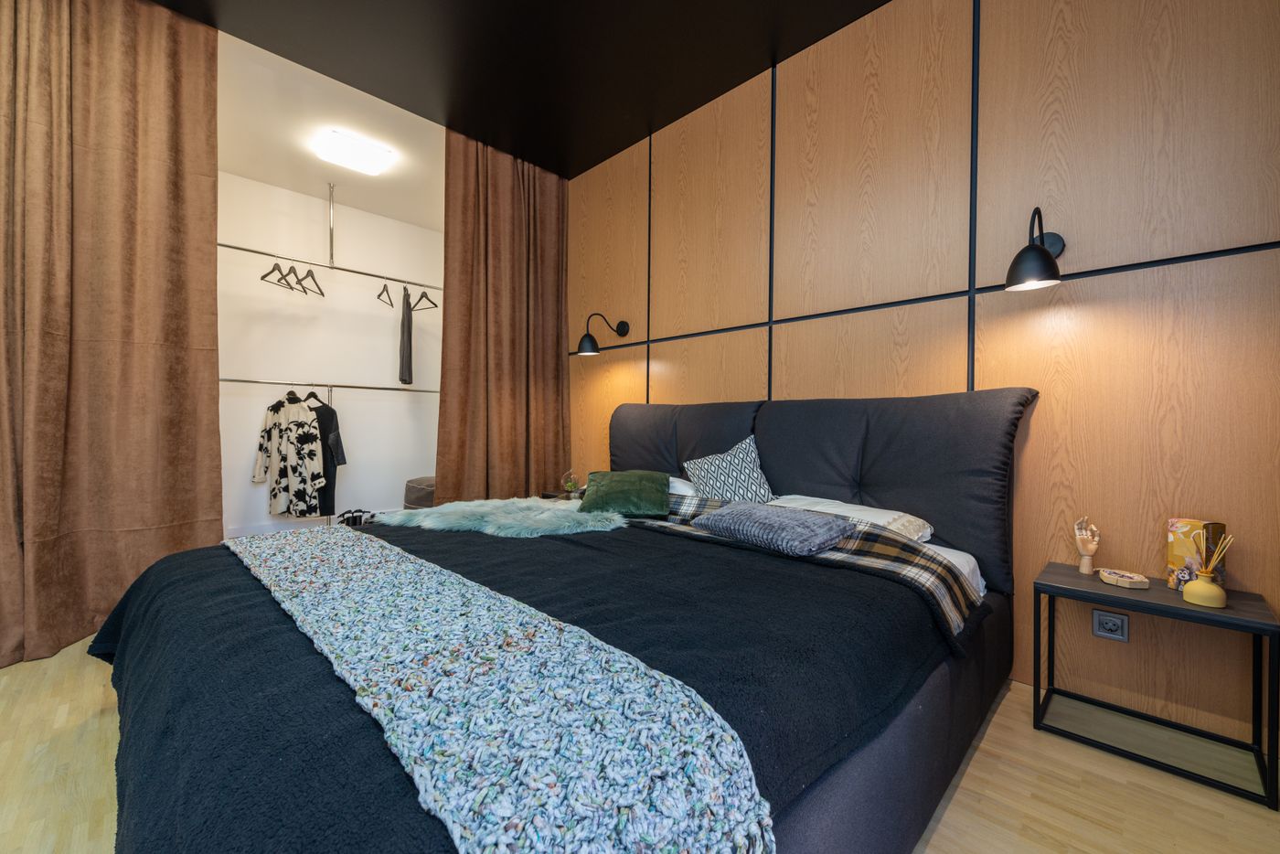 Contemporary bedroom with wardrobe and warm bedroom lighting
