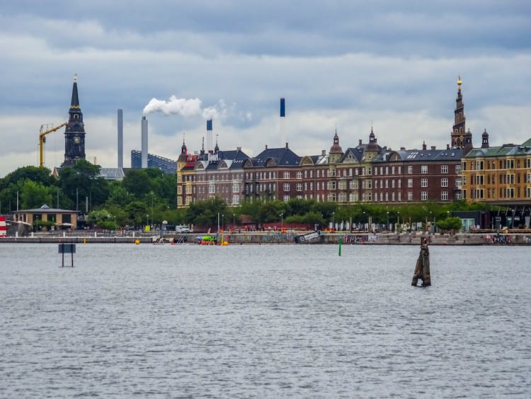 Row Of Buildings By Riverside