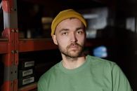Man in Green Crew Neck Shirt Wearing Yellow Knit Cap