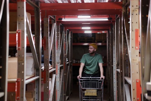 Free Storage Man pushing a Cart  Stock Photo