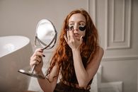 Woman in Black Tank Top Wearing Silver Framed Aviator Sunglasses