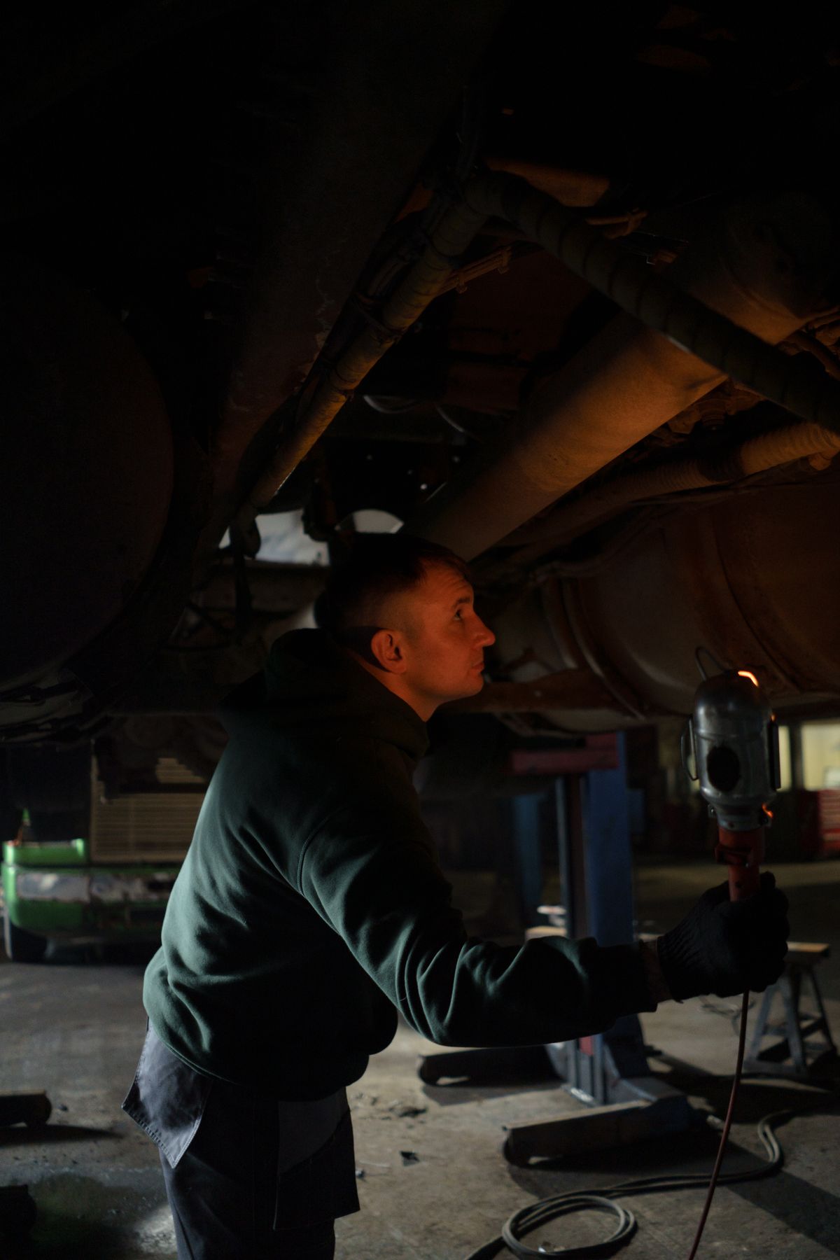 Technician inspecting an automobile
