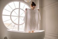 Woman Covering Her Body with a Towel