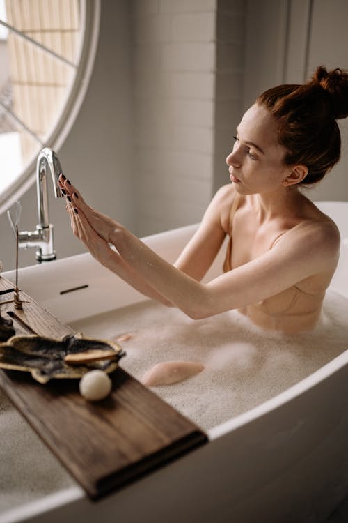 Free Naked Woman Sitting on Bathtub Stock Photo