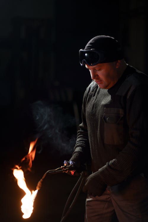 A Man using Acetylene Torch