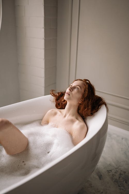 Free Topless Woman in White Bathtub Stock Photo