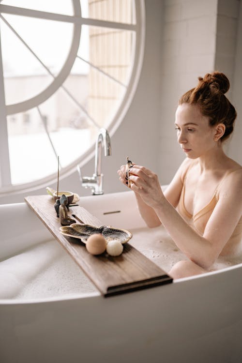 Free A Woman Doing Bath Rituals  Stock Photo