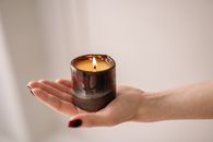 Person Holding Black Candle Holder