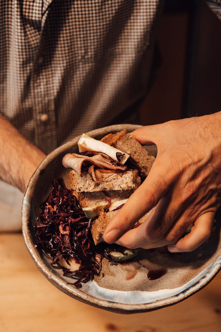 Crop Man With Delicious Sandwich On Old Plate