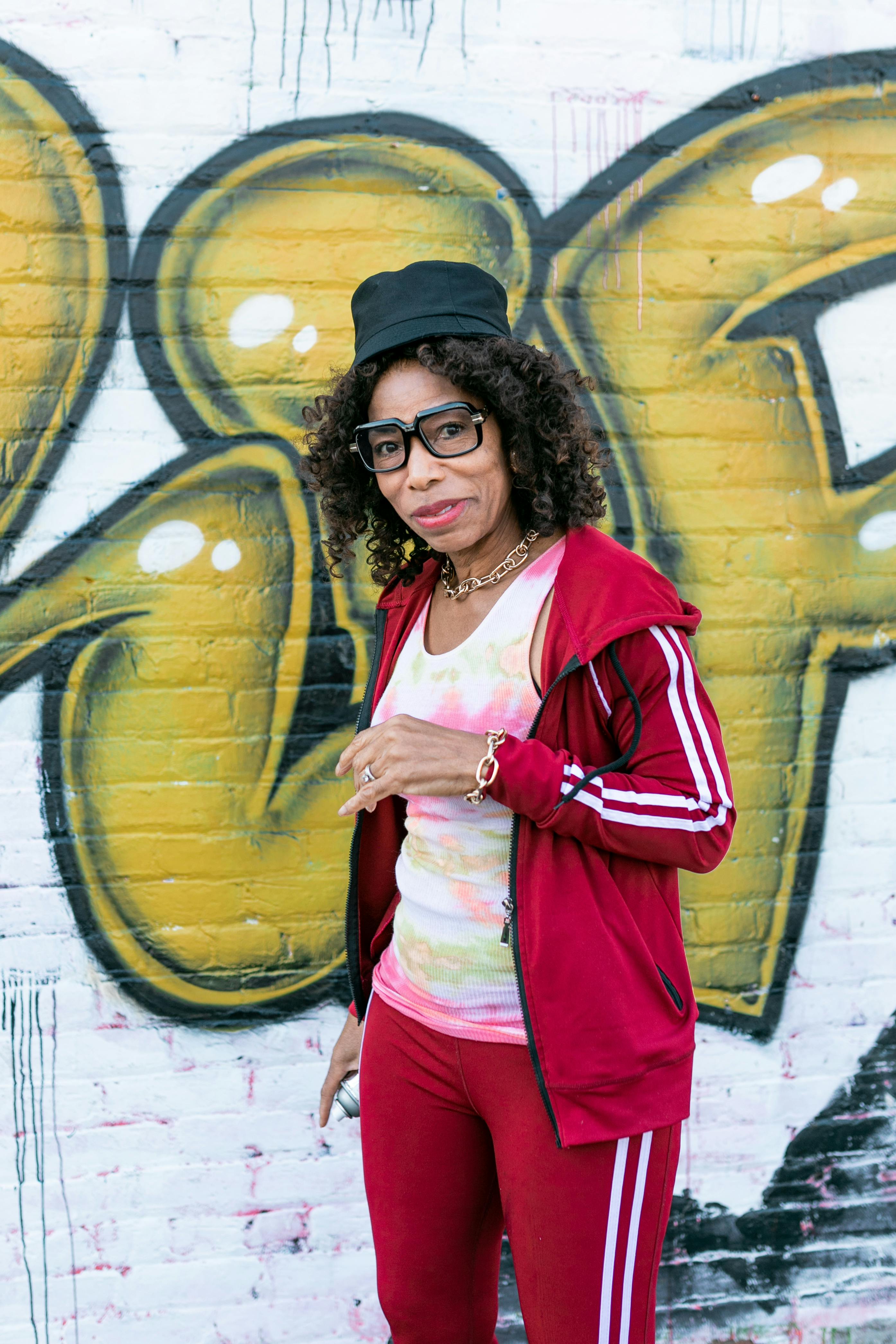 woman in red and white long sleeve jacket and black cap