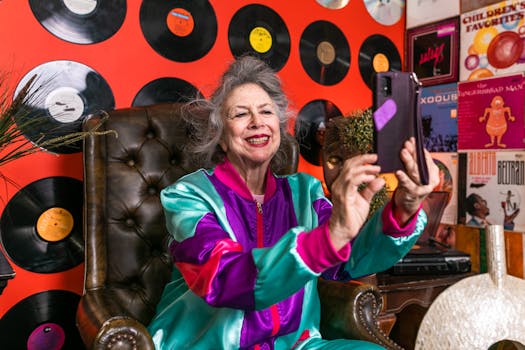 Stylish senior woman takes a selfie in colorful retro-themed room with vinyl records.