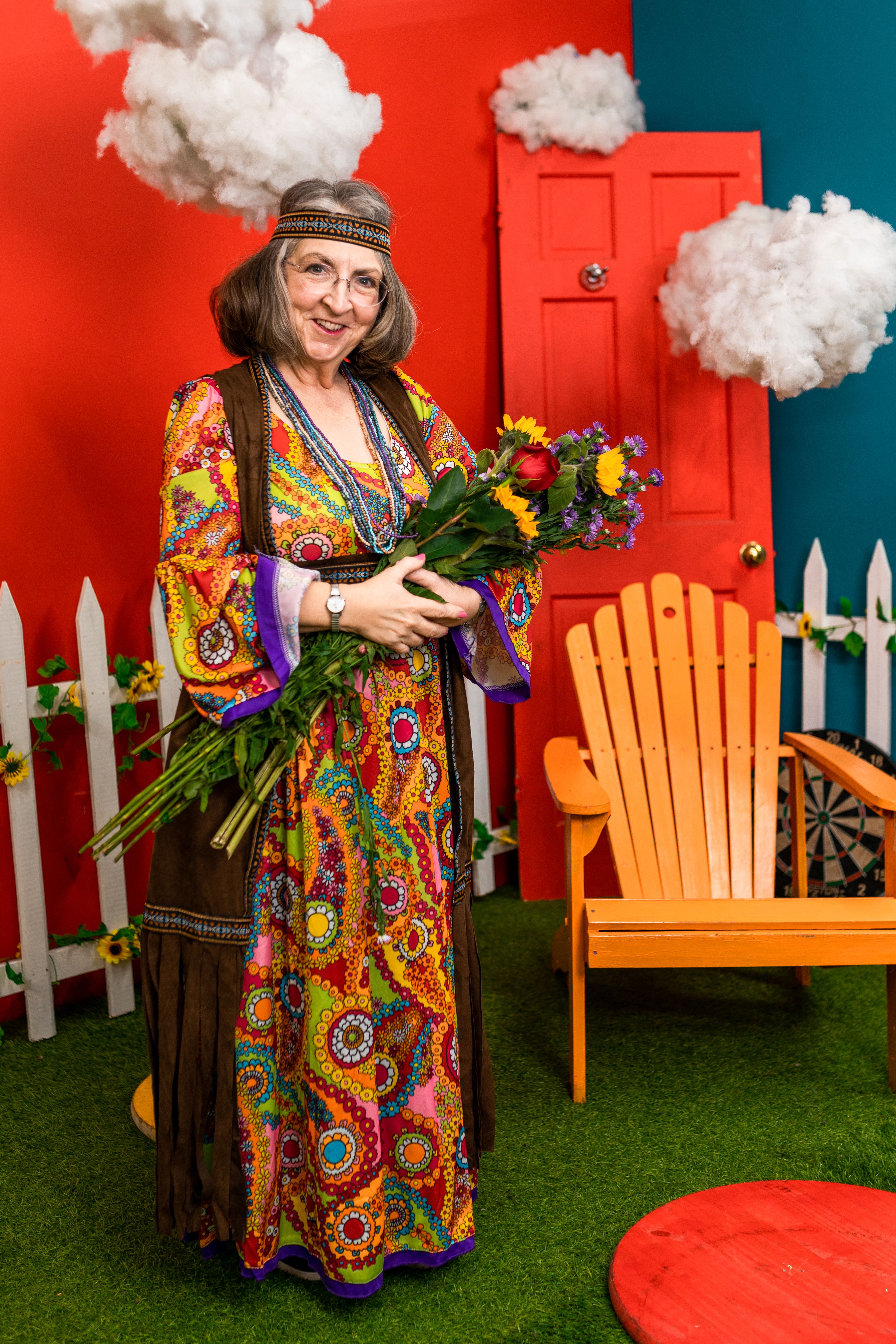 Woman in Floral Dress Holding Bouquet of Flowers · Free Stock Photo