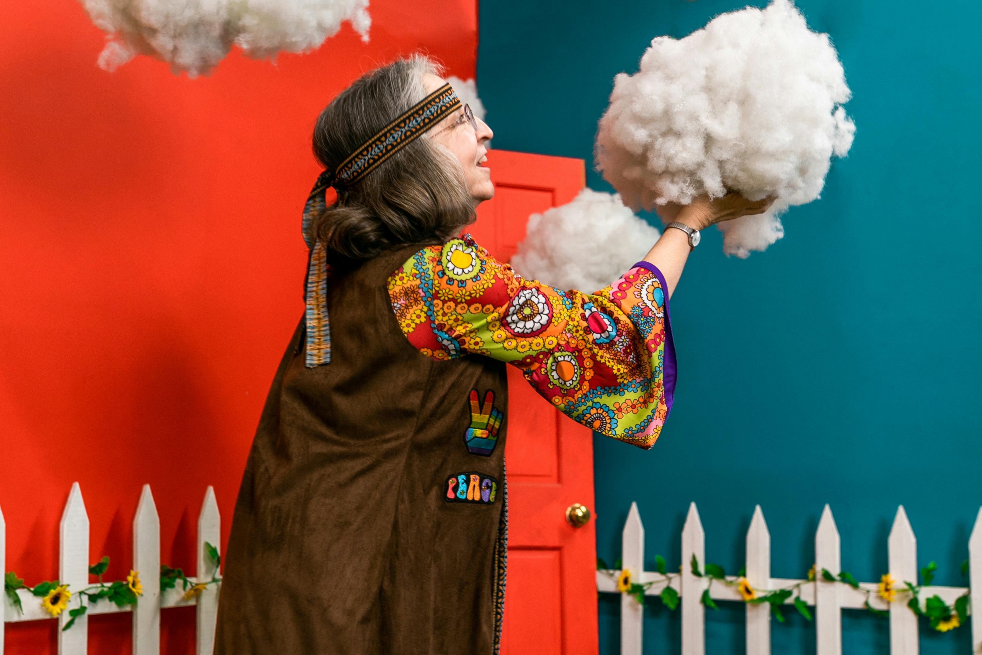 woman holding a white cloud decor