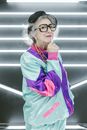 Woman in Red and Green Zip Up Jacket Wearing Eyeglasses