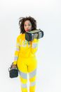 Woman in Yellow and Gray Long Sleeve Sportswear Holding Weights