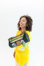 Woman in Yellow Sports Wear Carrying Weights