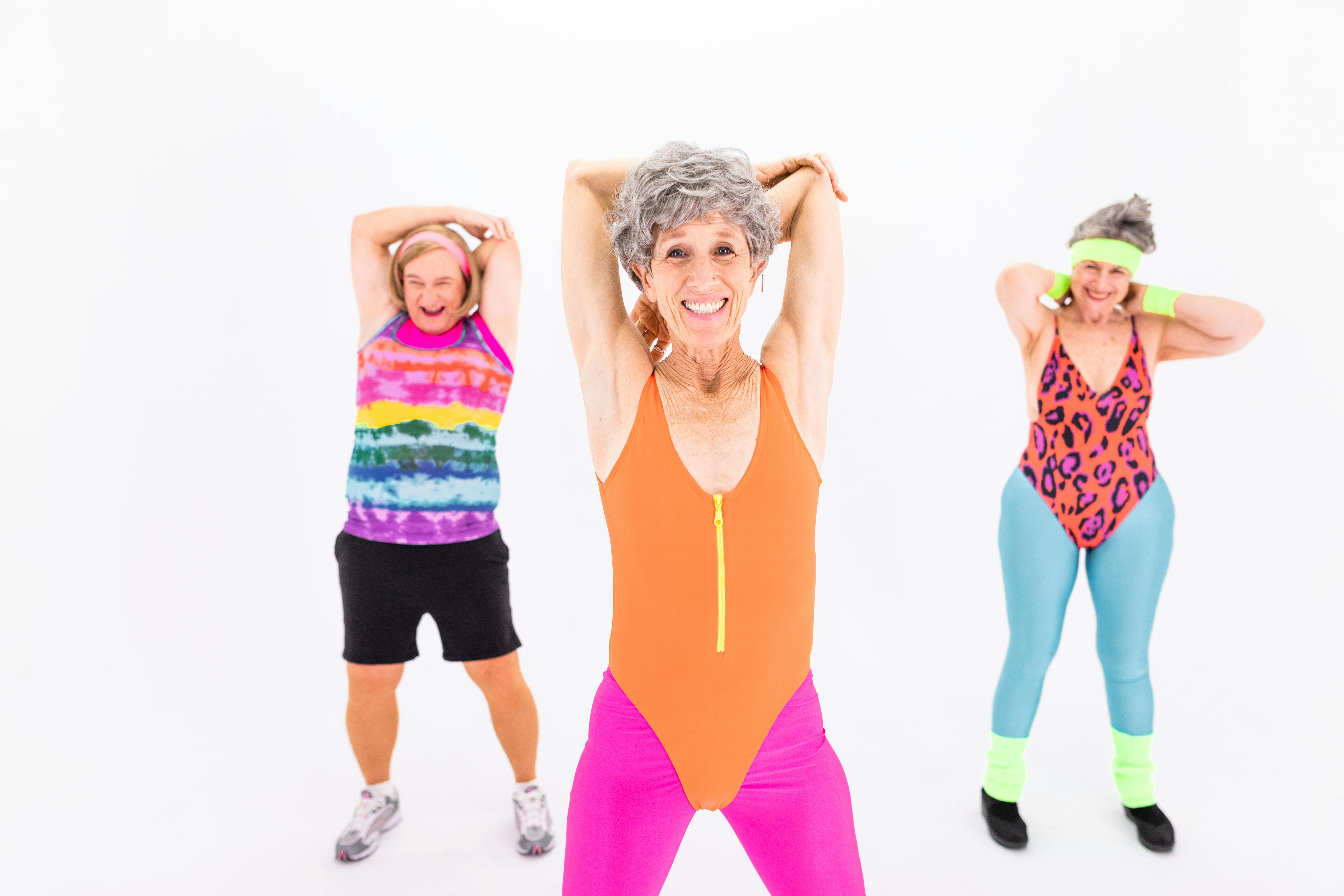 Group of diverse people dancing in a studio