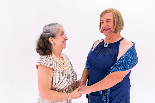 Two Elderly Women Holding Each Other's Hands