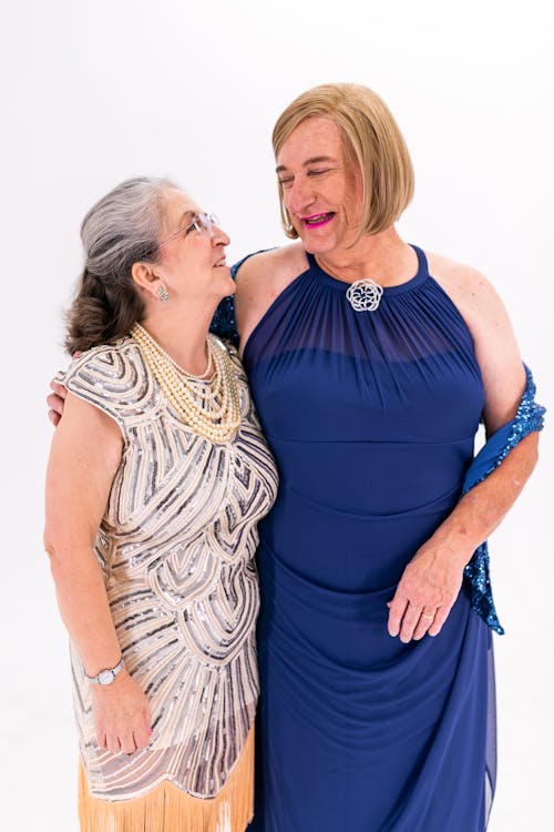 Two Elderly Women Standing Next To Each Other