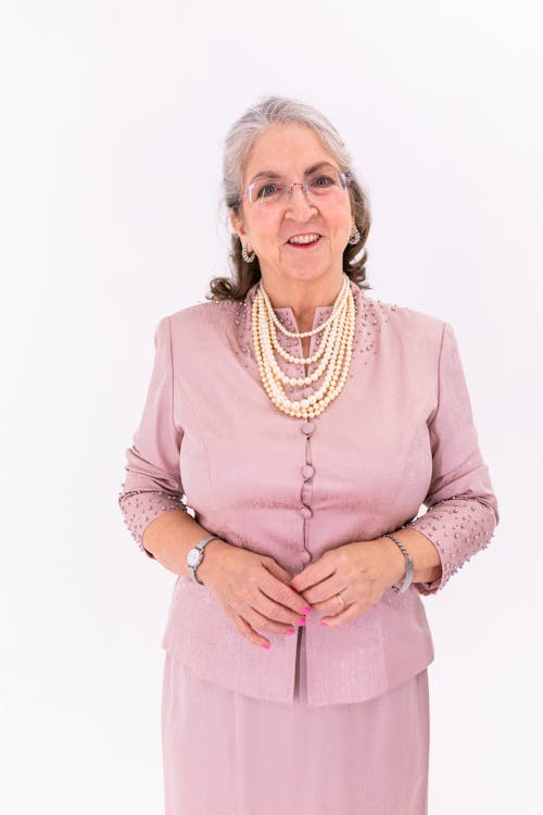 Elderly Woman in Pink Long Sleeve Dress
