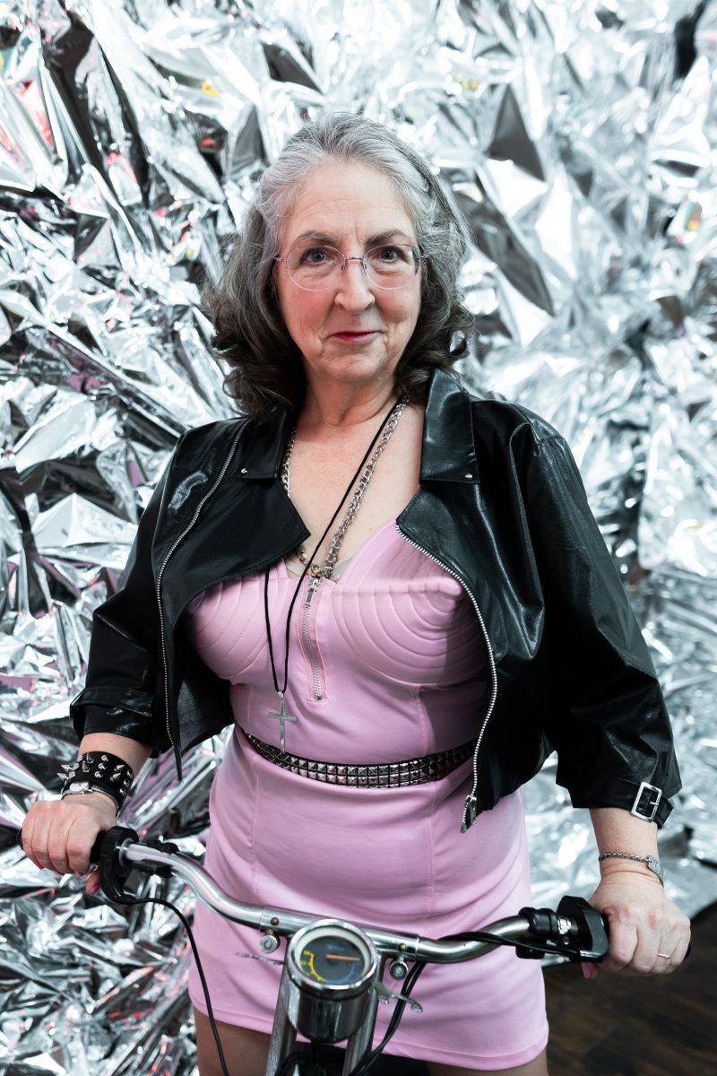 Stylish older woman in a black leather jacket