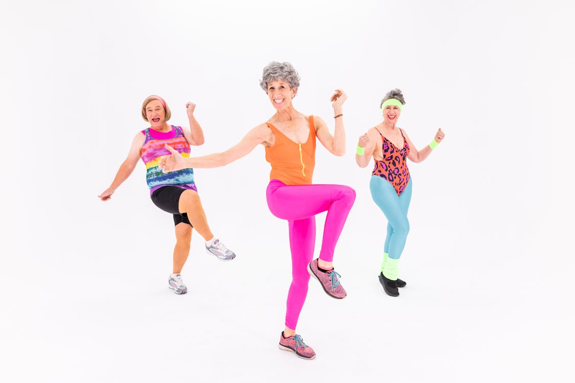 3 Women in Colorful Aerobics Outfit · Free Stock Photo