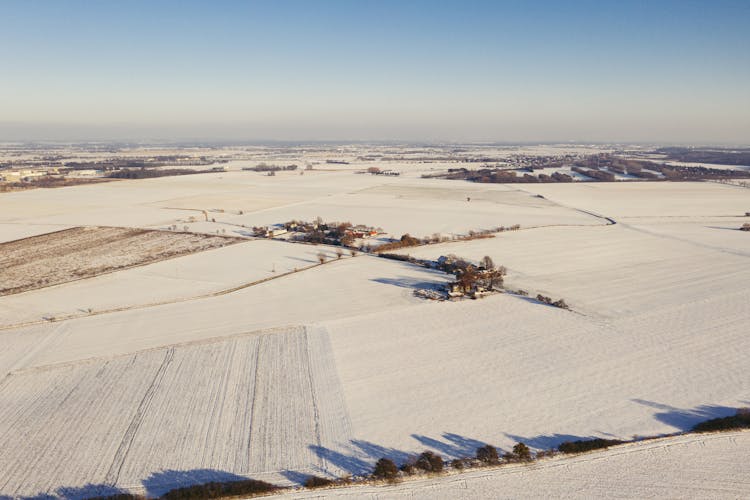 Drone Shot Of Fields With Snow