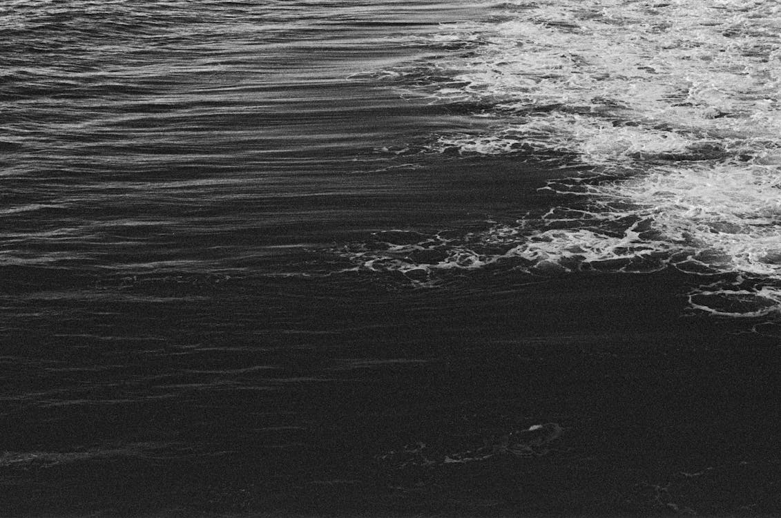 Grayscale Photo of Water Waves