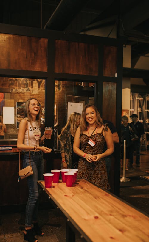 Photograph of Women Playing Beer Pong